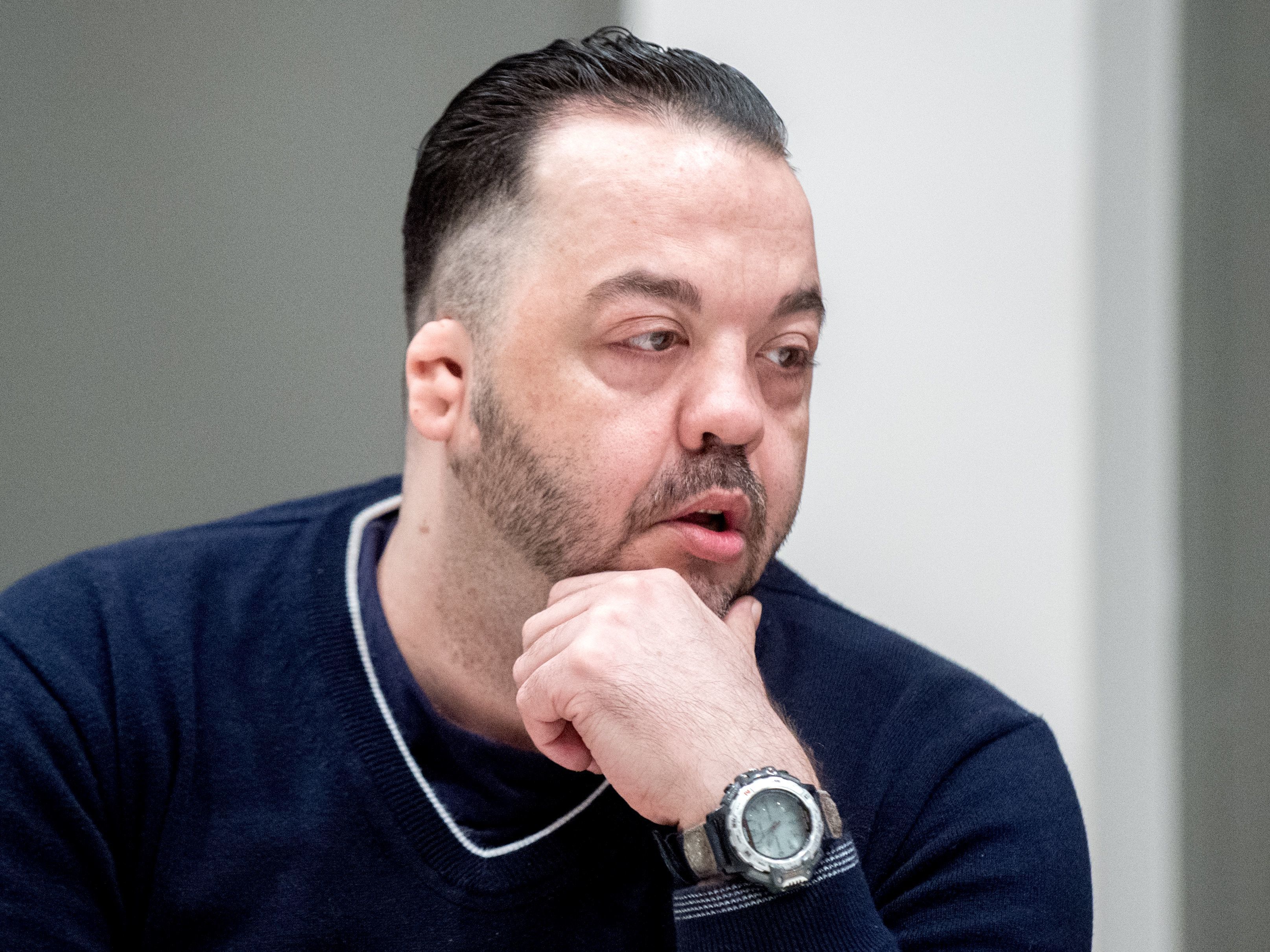 caption: Former nurse Niels Högel was found guilty of killing patients in his care by injecting them with drugs and then trying to resuscitate them. He's seen here in court, awaiting his verdict in Oldenburg, Germany.