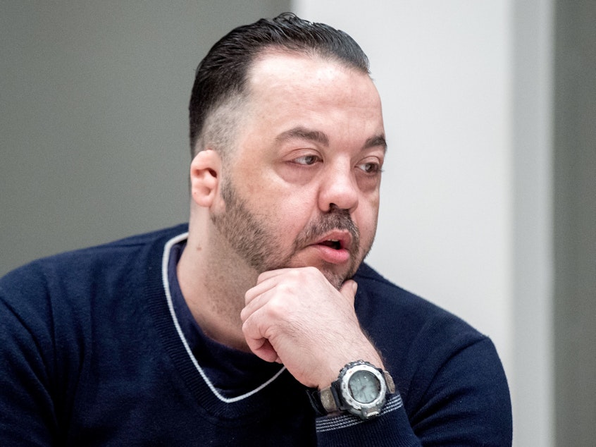 caption: Former nurse Niels Högel was found guilty of killing patients in his care by injecting them with drugs and then trying to resuscitate them. He's seen here in court, awaiting his verdict in Oldenburg, Germany.