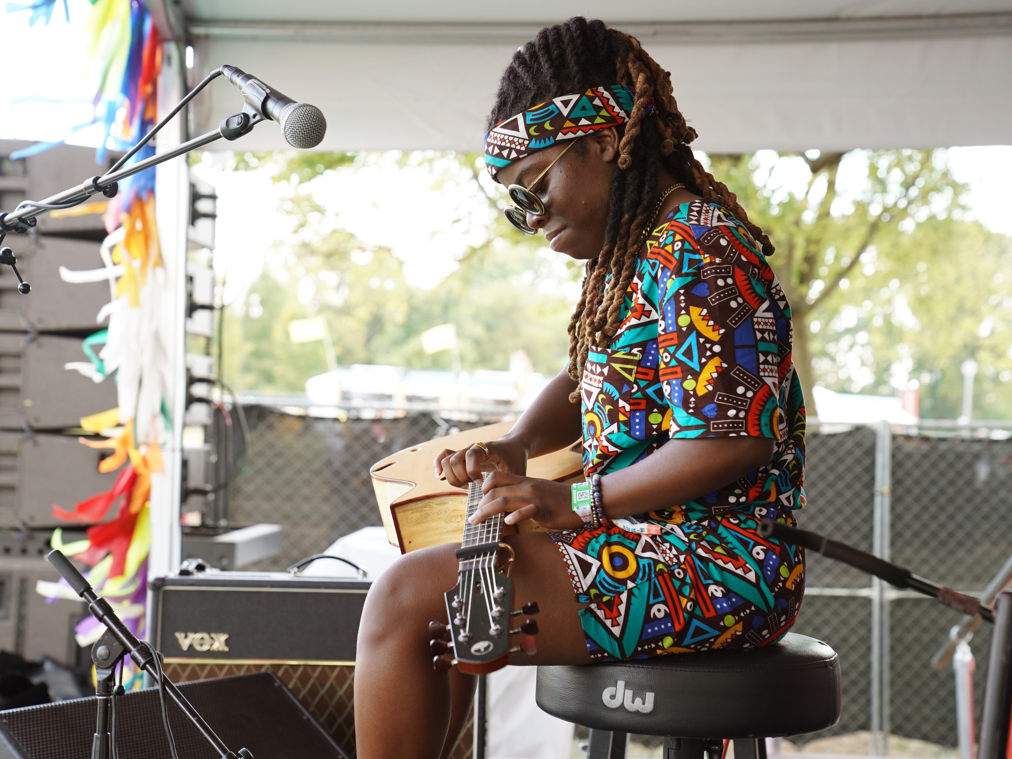caption: Yasmin Williams, seen here performing during the 2022 Pilgrimage Music &amp; Cultural Festival in Franklin, Tenn., had a confrontation last year with the interim president of the Kennedy Center, where she had been scheduled to perform, over the institution's rollback of DEI initiatives. Williams did not cancel her performance.