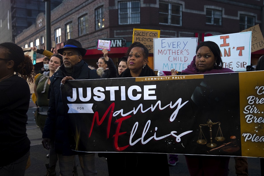 caption: Candace Wesley, center, joins family, friends and supporters for a rally in honor of Manuel Ellis following a verdict of not guilty for the three Tacoma police officers involved in the death of Ellis, on Thursday, December 21, 2023, in Tacoma. 