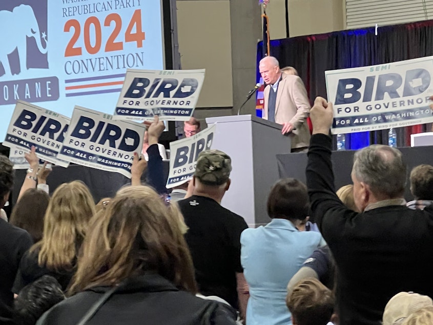 caption: Washington State Republican Chairman Jim Walsh speaks to party delegates at the state GOP convention on April 19, 2024, during a raucous vote to allow consideration of gubernatorial candidate Semi Bird for the party's endorsement.