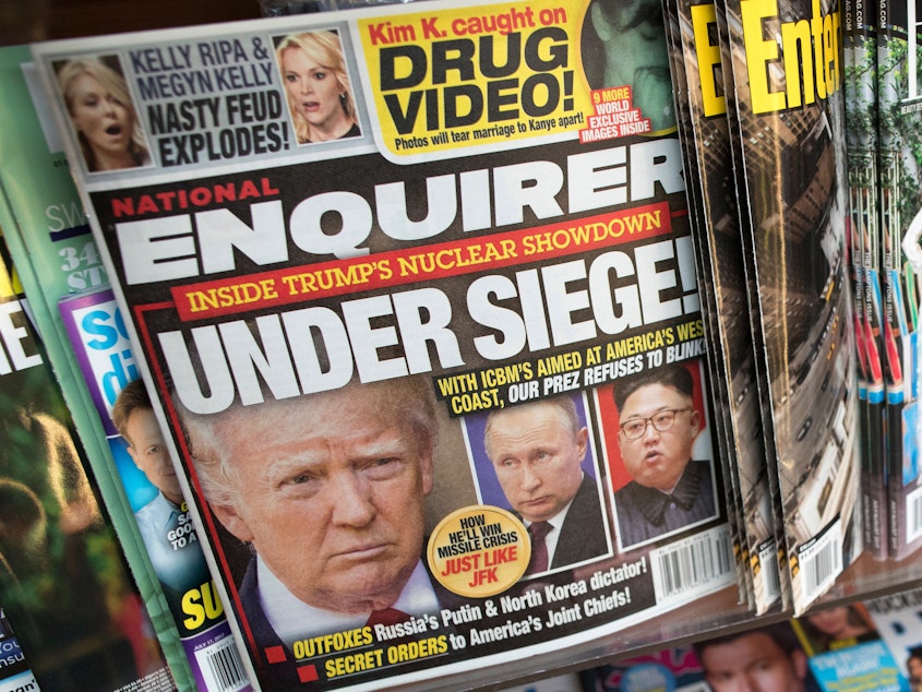 caption: The cover of the National Enquirer in July 2017 featuring President Trump. The tabloid is for sale.