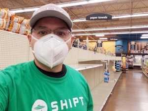 caption: Willy Solis, who delivers groceries for the app Shipt in Denton, Texas, says the coronavirus pandemic has elevated the voices of workers like him, who are risking their lives to do essential jobs.