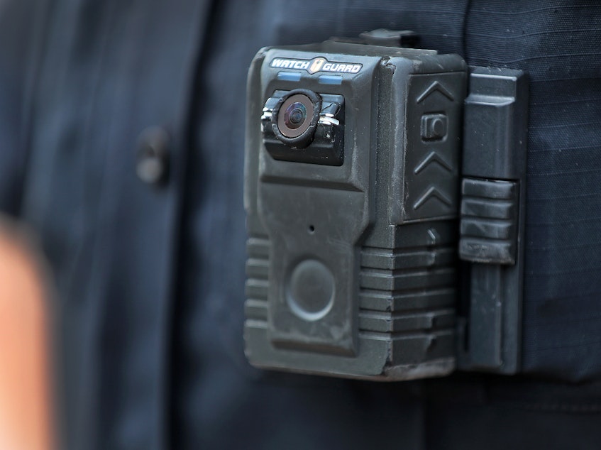 caption: Police officer David Moore is pictured wearing a body camera in Ipswich, Mass., on Dec. 1, 2020. The city was among 25 statewide awarded grants to purchase body-worn cameras for videotaping interactions with the public. A new study says the benefits to society and police departments outweigh the costs of the cameras.