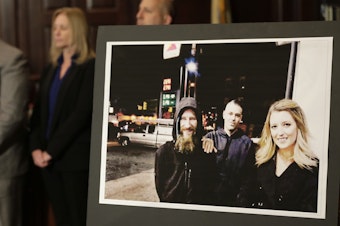 caption: A picture of Katelyn McClure, right, Mark D'Amico, center, and Johnny Bobbitt Jr. was displayed during a news conference in November. GoFundMe says it has refunded all donations to a campaign that featured a made-up story about Bobbitt, a homeless veteran.