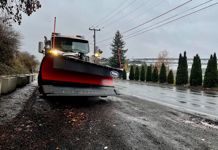caption: A snow plow activated as Seattle expects snow, Nov. 29, 2022. 