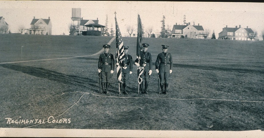 caption: Presentation of regimental colors on Fort Lawton parade grounds, 1937.