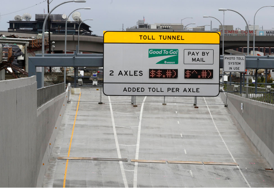 caption: A toll sign on a ramp leading to the tunnel that replaced the Alaskan Way Viaduct is shown Wednesday, Jan. 9, 2019, in Seattle. 