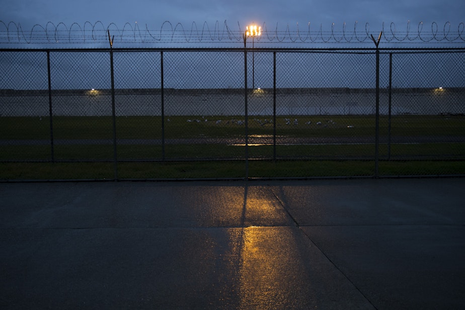 caption: Nightfall at the Monroe Correctional Complex on Wednesday, November 29, 2018. Two units at the prison are currently on "precautionary quarantine."