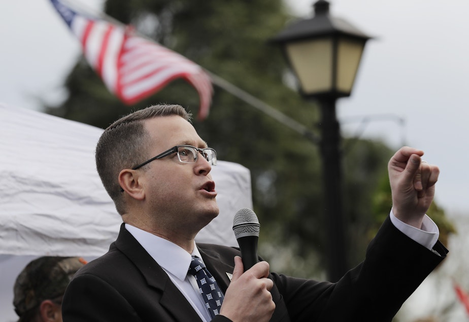 caption: Republican state Rep. Matt Shea, pictured at at a gun-rights rally in January, has been suspended from the House Republican Caucus. He was also removed from several committees.