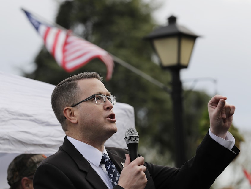 caption: Republican state Rep. Matt Shea, pictured at at a gun-rights rally in January, has been suspended from the House Republican Caucus. He was also removed from several committees.