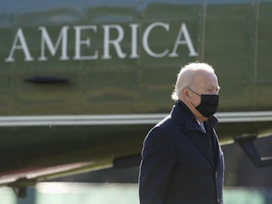 caption: President Joe Biden walks to the Oval Office of the White House after stepping off Marine One on Jan. 10, 2022.