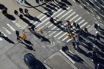caption: Pedestrians outside the Port Authority Bus Terminal in Manhattan on January 01, 2023.