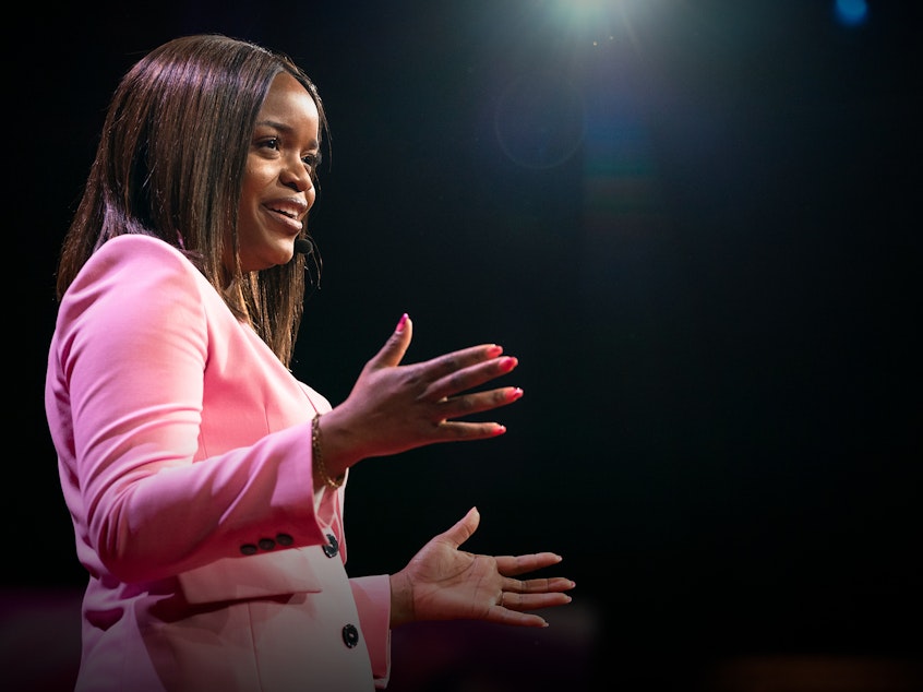 caption: Brittany Packnett on the TED stage