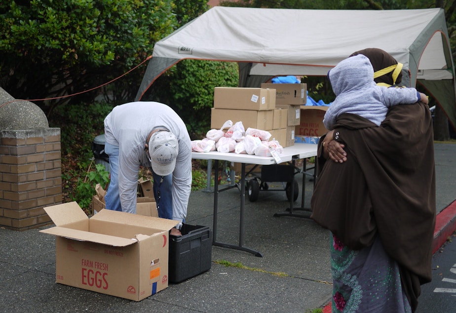 caption: Gerald  Donaldson, a family support worker at Leschi Elementary in Seattle, helps families access food during the Covid-19 pandemic.