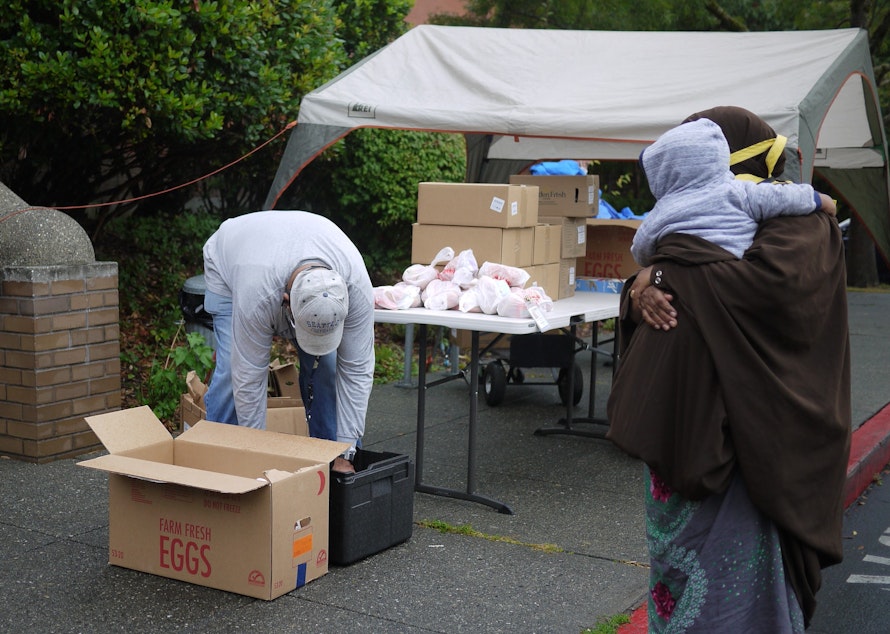 caption: Gerald  Donaldson, a family support worker at Leschi Elementary in Seattle, helps families access food during the Covid-19 pandemic.
