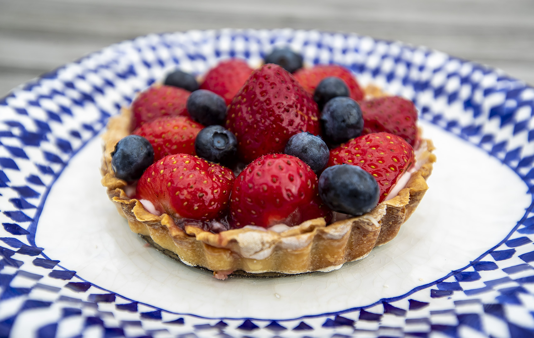 caption: Kathy's strawberry-blueberry tart. (Jesse Costa/WBUR)