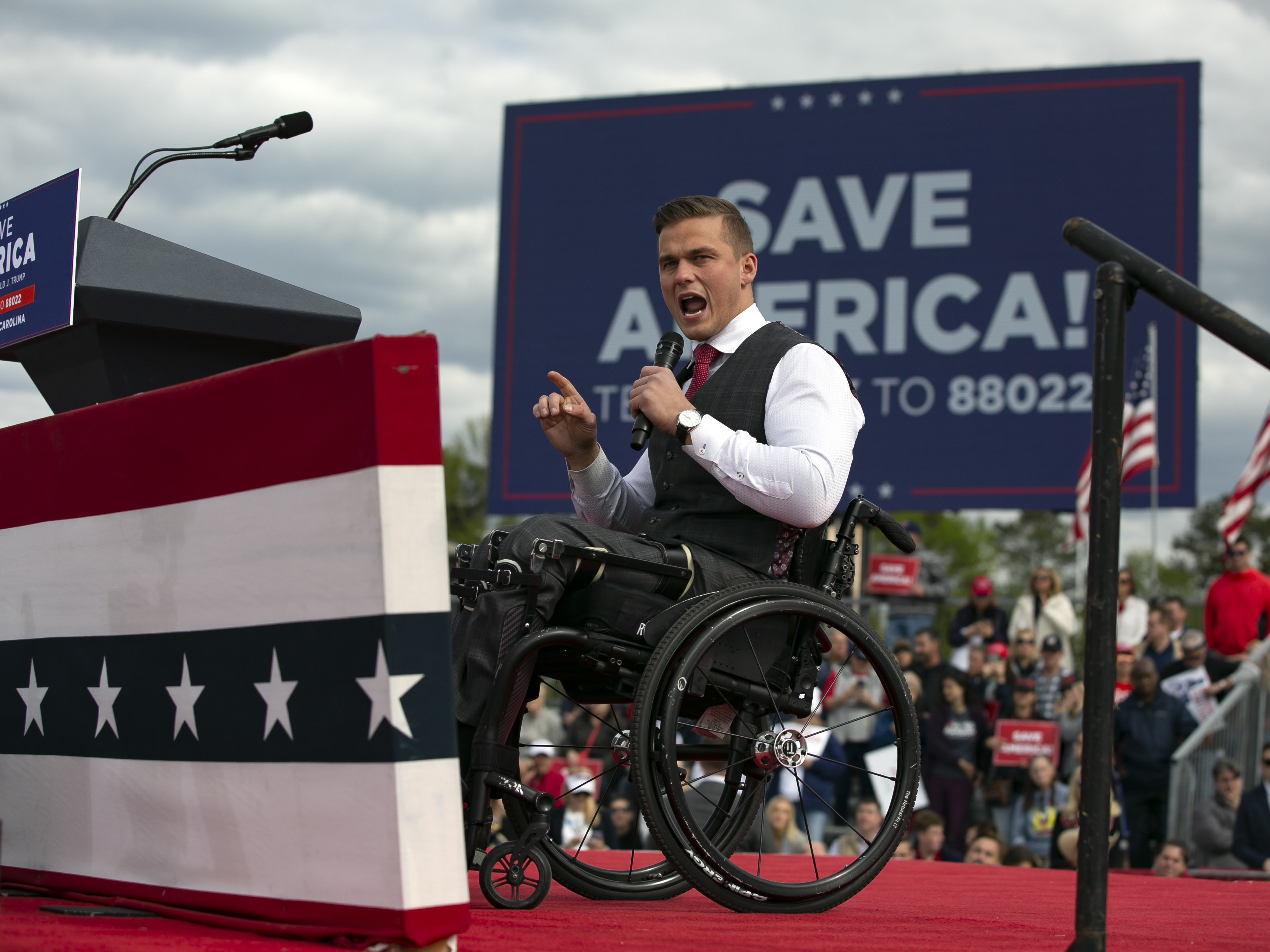 caption: Rep. Madison Cawthorn addressed the crowd at a rally for former President Donald Trump on April 9 in Selma, N.C.