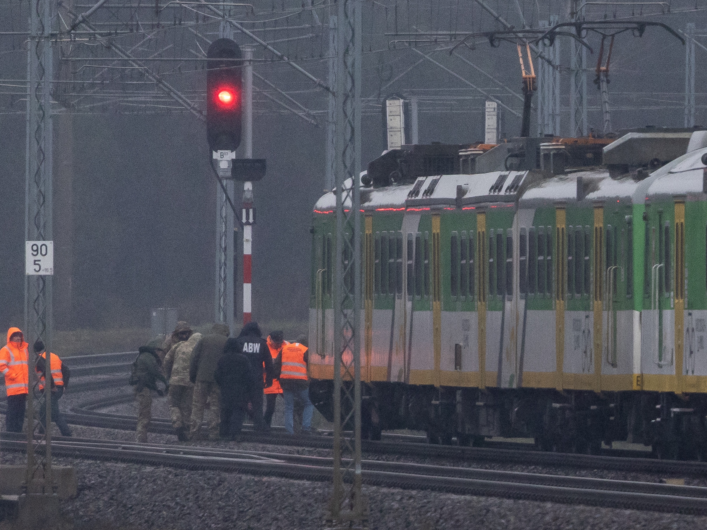 caption: Investigators examine a rail line damaged in an explosion in Mika, next to Garwolin, central Poland, on Nov. 17, 2025. Polish Prime Minister Donald Tusk said the explosion that damaged a railway line to its close ally Ukraine was an "act of sabotage."
