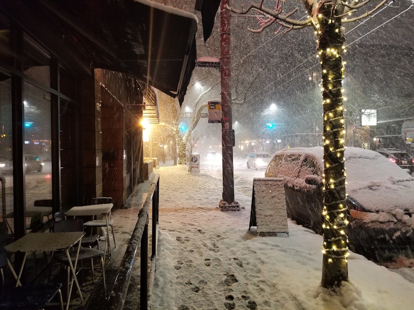 caption: Snow piles up on a sidewalk on Capitol Hill on Sunday, February 10, 2019.