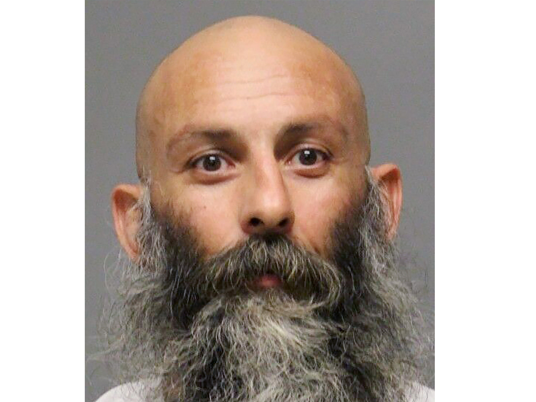 caption: This undated booking photo provided by the Delaware Department of Justice shows Barry Croft Jr. Croft, a Delaware trucker described as a co-leader of the conspiracy to kidnap Michigan's governor, was sentenced to more than 19 years in prison on Wednesday, a day after an accomplice received 16 years behind bars.