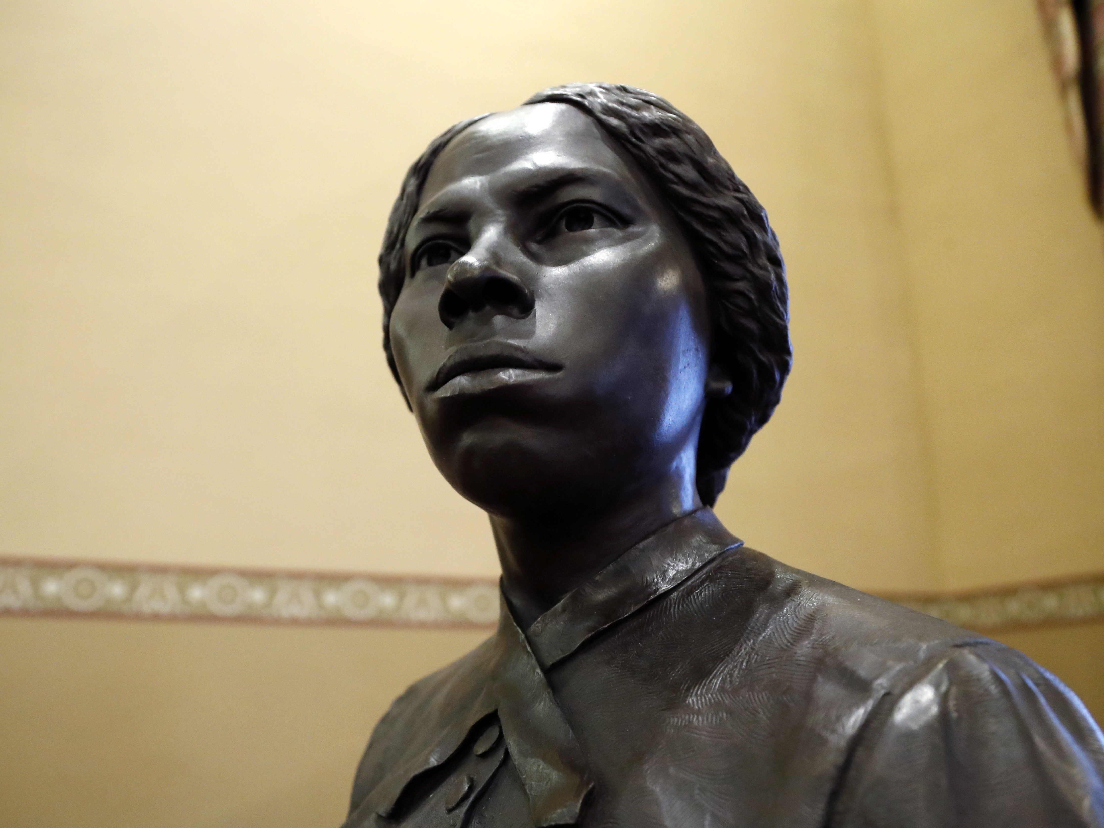 caption: A bronze statue of abolitionist Harriet Tubman is seen at the Maryland State House, Feb. 10, 2020, in Annapolis, Md.