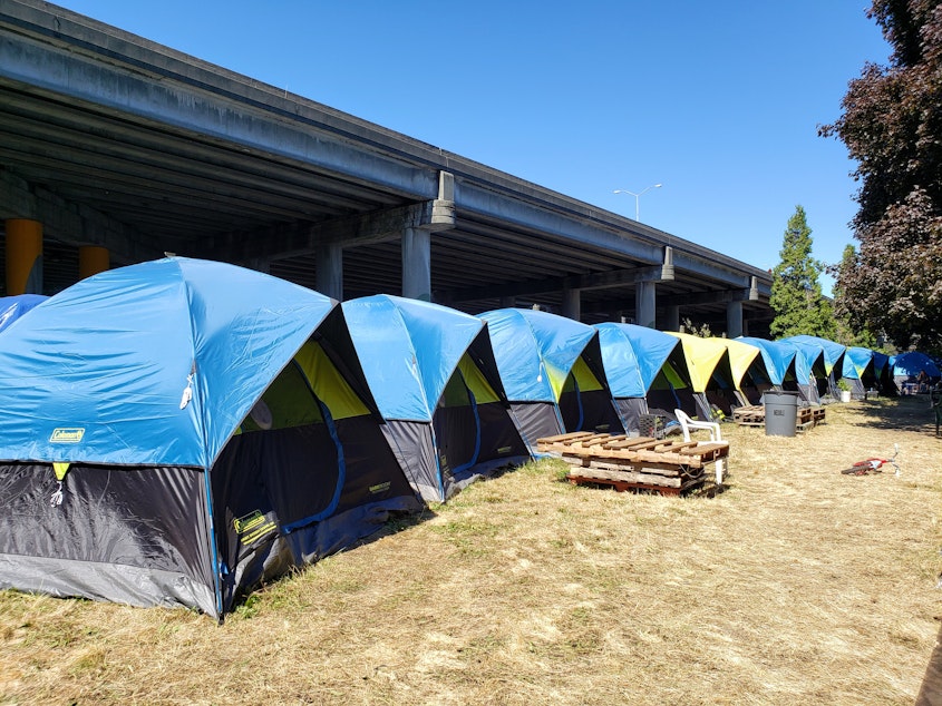 caption: Tent City 3 near I-5 in Ravenna on Tuesday, August 27th, 2019.