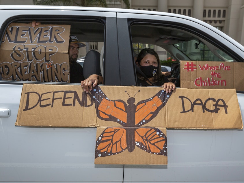 caption: People demonstrate in June in Los Angeles in favor of the Deferred Action for Childhood Arrivals program. Immigrant rights advocates hailed a Friday court ruling allowing new applications as a "huge victory for people who have been waiting to apply for DACA for the first time."
