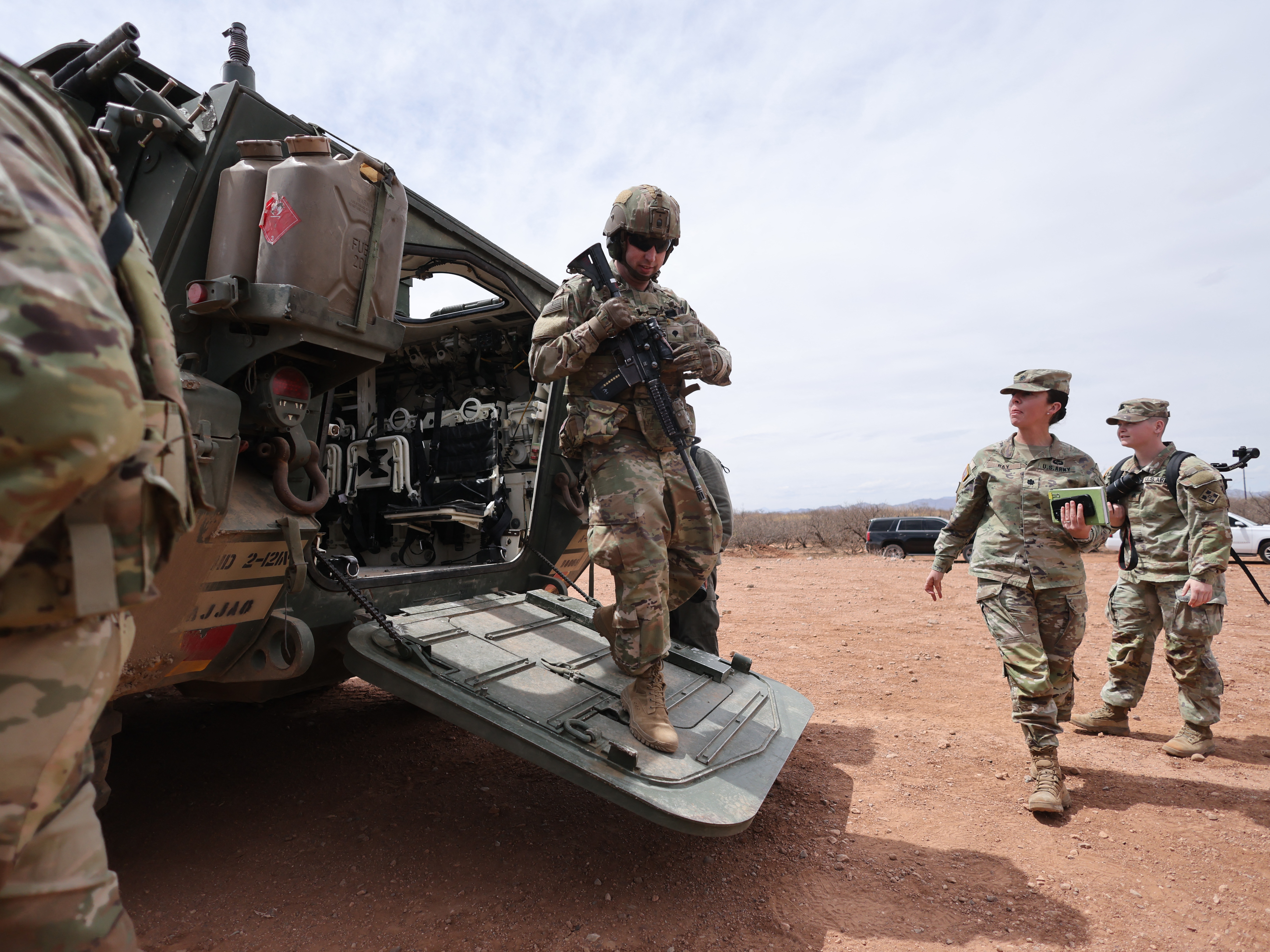 caption: A Stryker platoon is stationed near the fence at the southern U.S. border with Mexico, in Douglas, Arizona, on April 3.