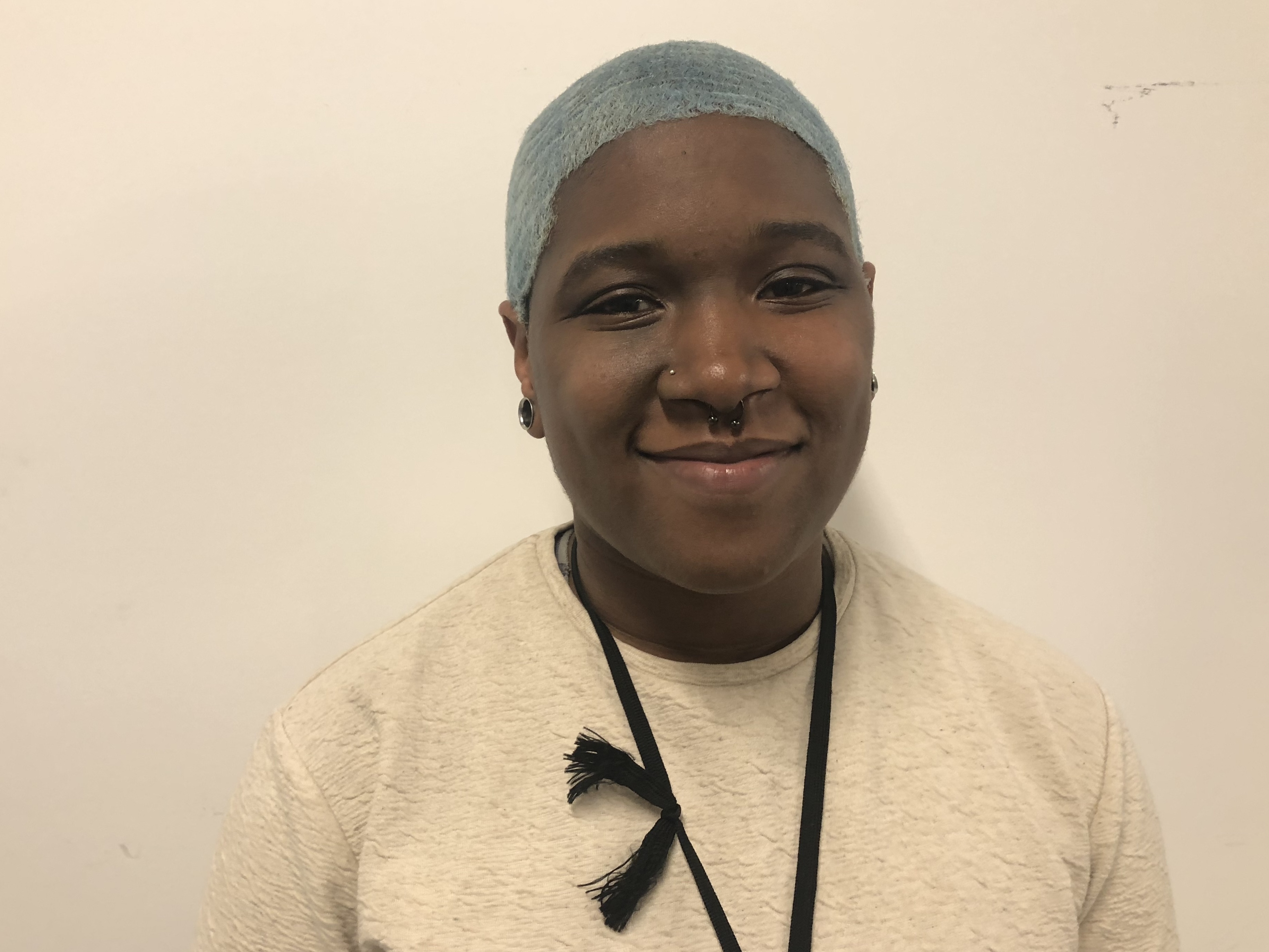 caption: Ivy Strickland studies coding at Pursuit, which trains adults in need for tech jobs.