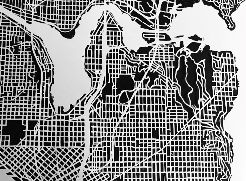 caption: Cut map illustrating the growth of Seattle from 1894 – 2017 by GirlSpit