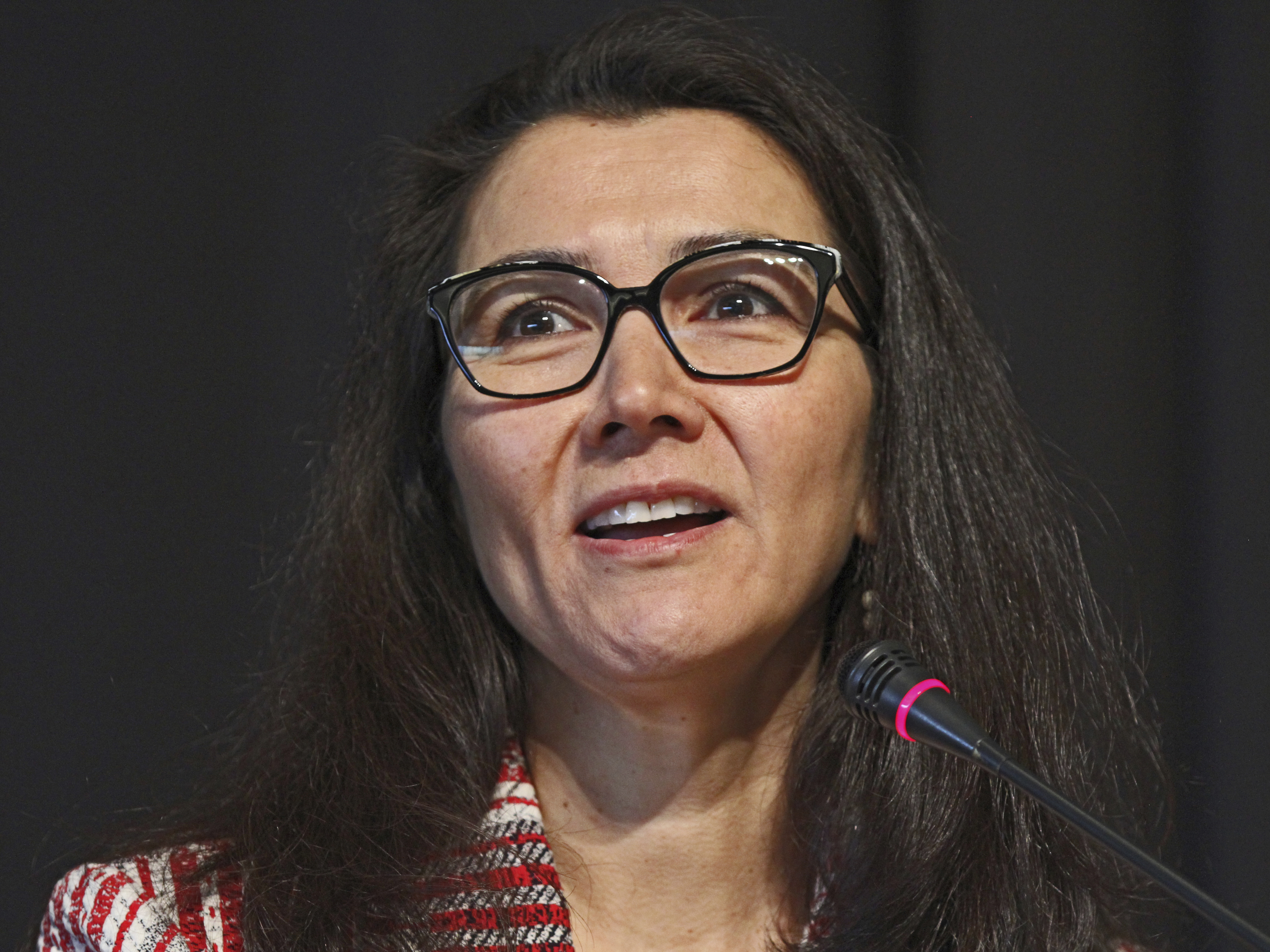 caption: Mary Peltola, a Democrat, speaks during a forum for U.S. House candidates on May 12 in Anchorage, Alaska.