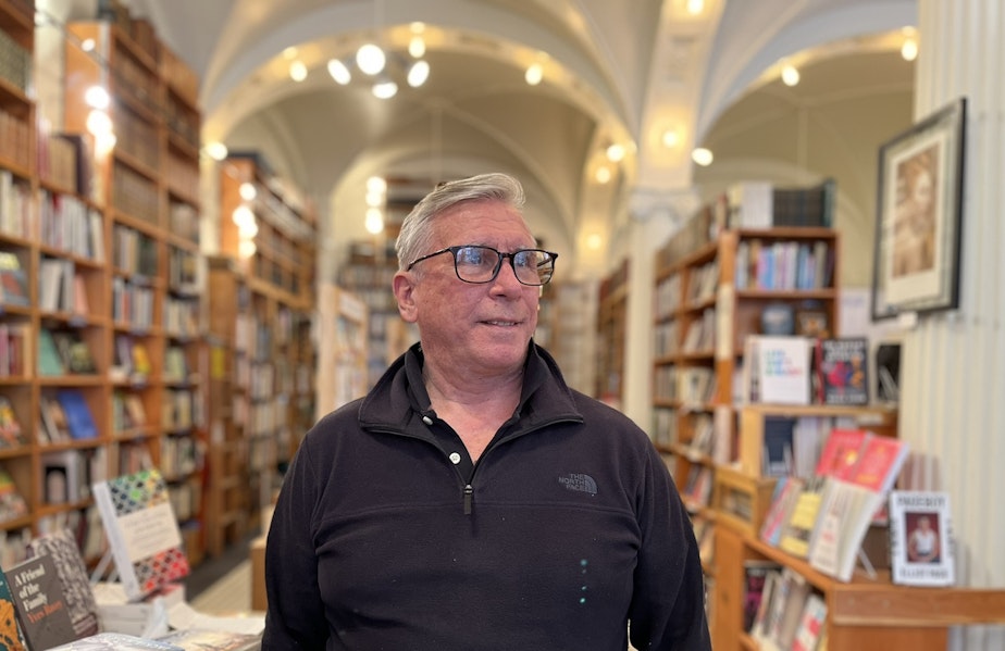 caption: Phil Bevis at Arundel Books in Seattle's Pioneer Square.