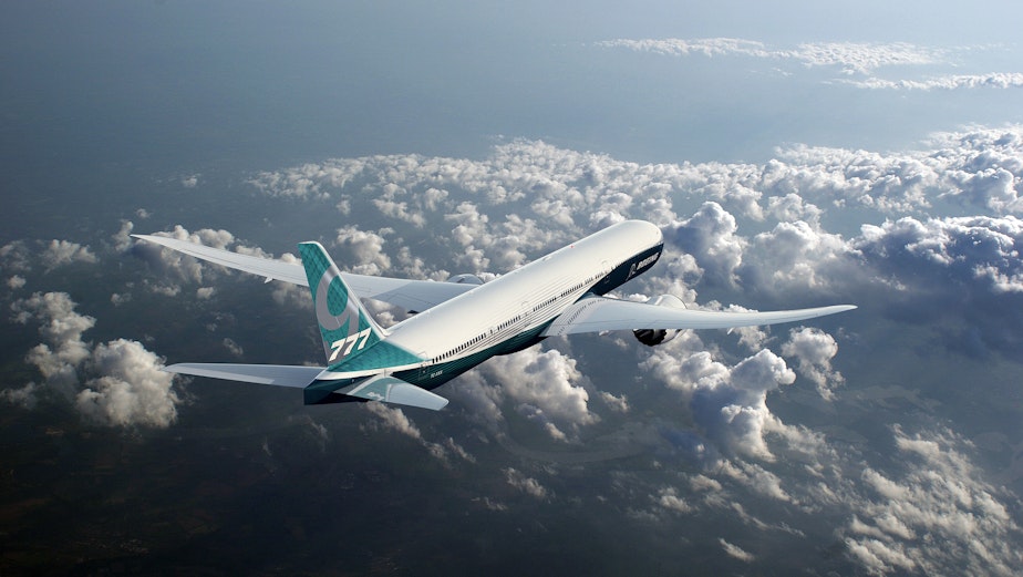 caption: At the heart of the debate: The Boeing 777X jetliner (a prototype).