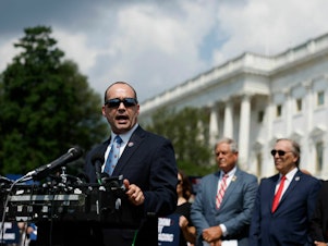 caption: Rep. Bob Good, R-Va., speaks at a news conference with members of the House Freedom Caucus outside the U.S. Capitol on July 25.