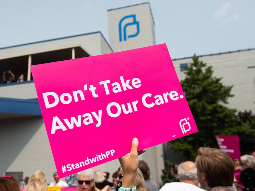 caption: Abortion rights supporters rally outside a Planned Parenthood clinic in St. Louis on May 31, 2019. At the time, it was the last location in Missouri performing abortions. The state's abortion ban took effect soon after the Dobbs decision in 2022.