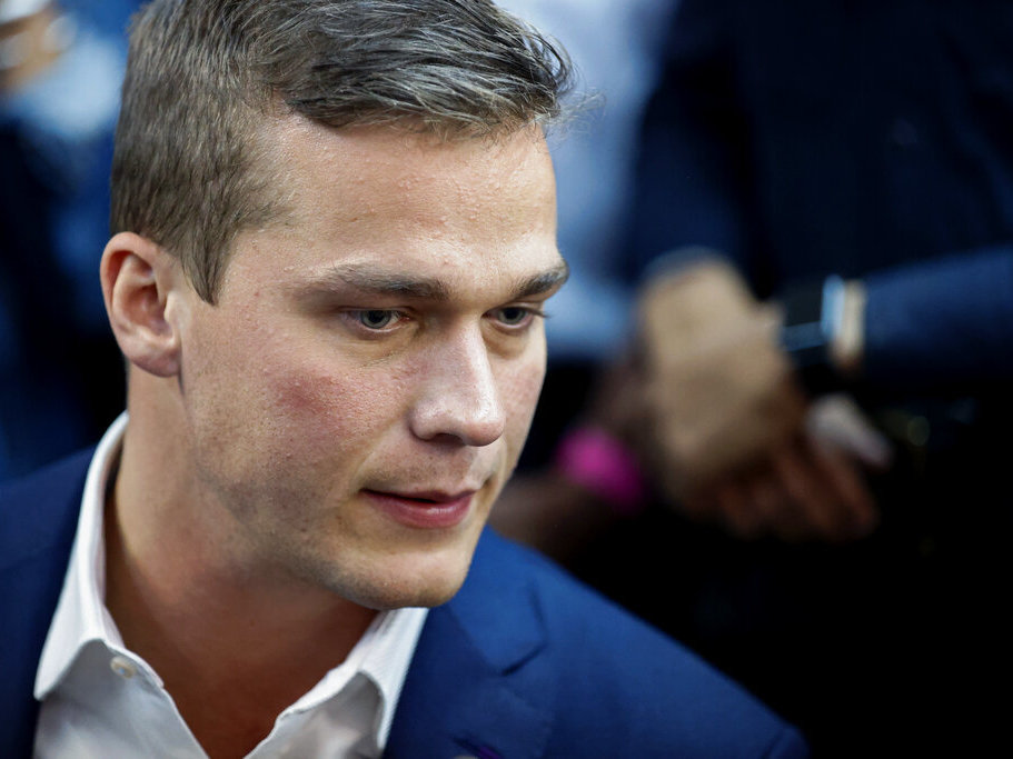 caption: U.S. Rep. Madison Cawthorn, R-N.C., speaks to supporters and the media in May at his primary election night watch party in Hendersonville, N.C..