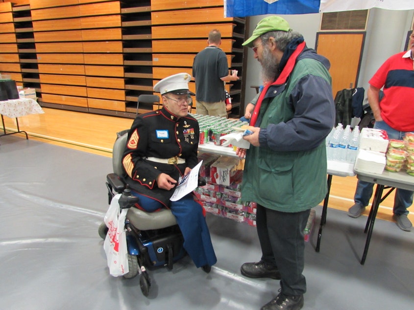 caption: Marine Veteran Vincent Romano with a fellow veteran. Romano served between 1967 and 2006. 