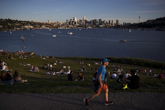 caption: People gather on Wednesday, May 27, 2020, at Gas Works Park in Seattle. 