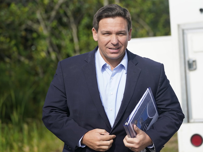 caption: At a news conference in Miami last week, Florida Gov. Ron DeSantis insisted that the state's record spike in COVID-19 hospitalizations will be short-lived.