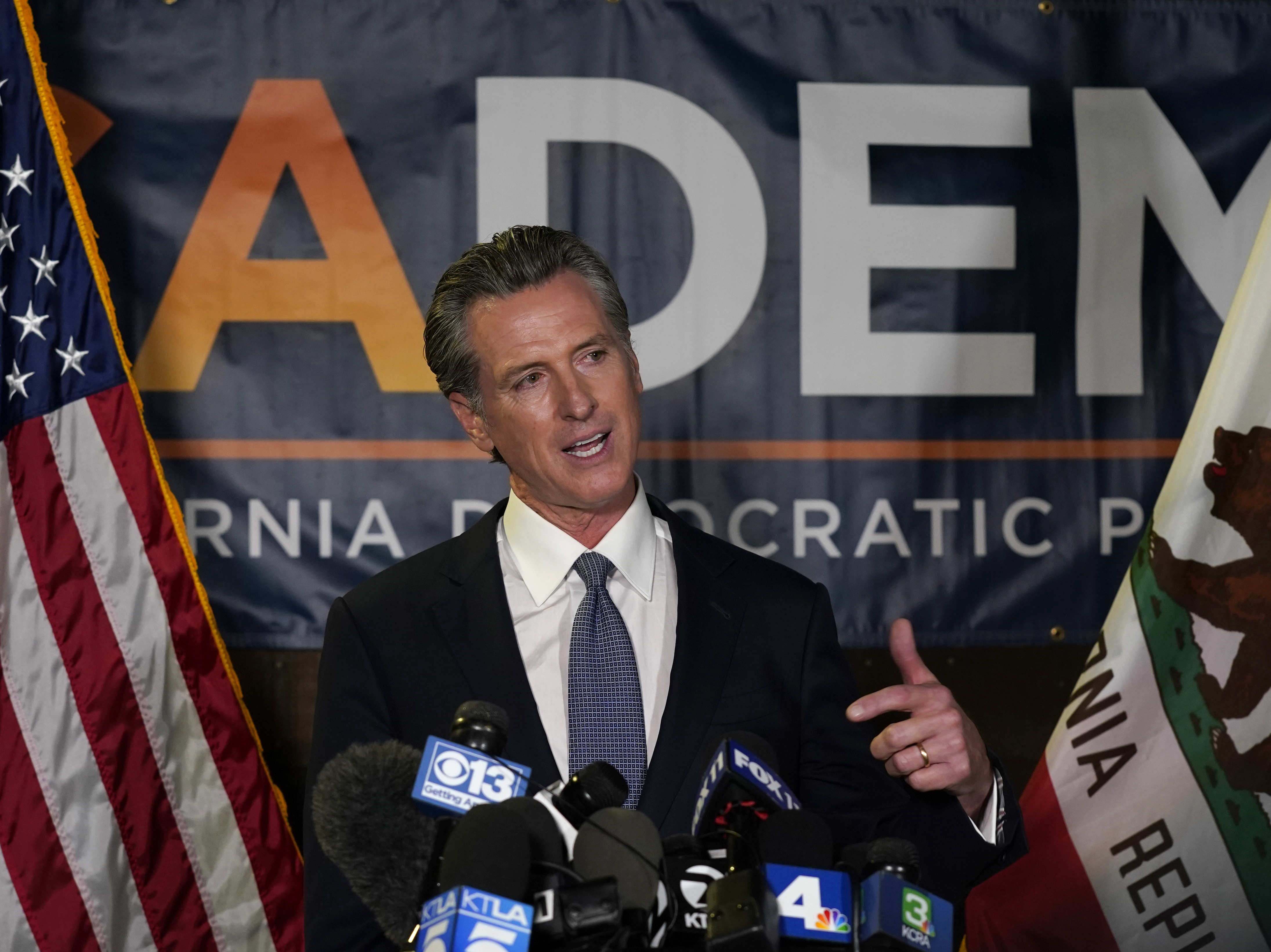 caption: California Gov. Gavin Newsom addresses reporters after beating back the recall that aimed to remove him from office.