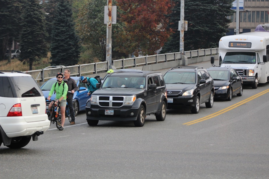 caption: Cyclists at Pine and Boren await their turn.