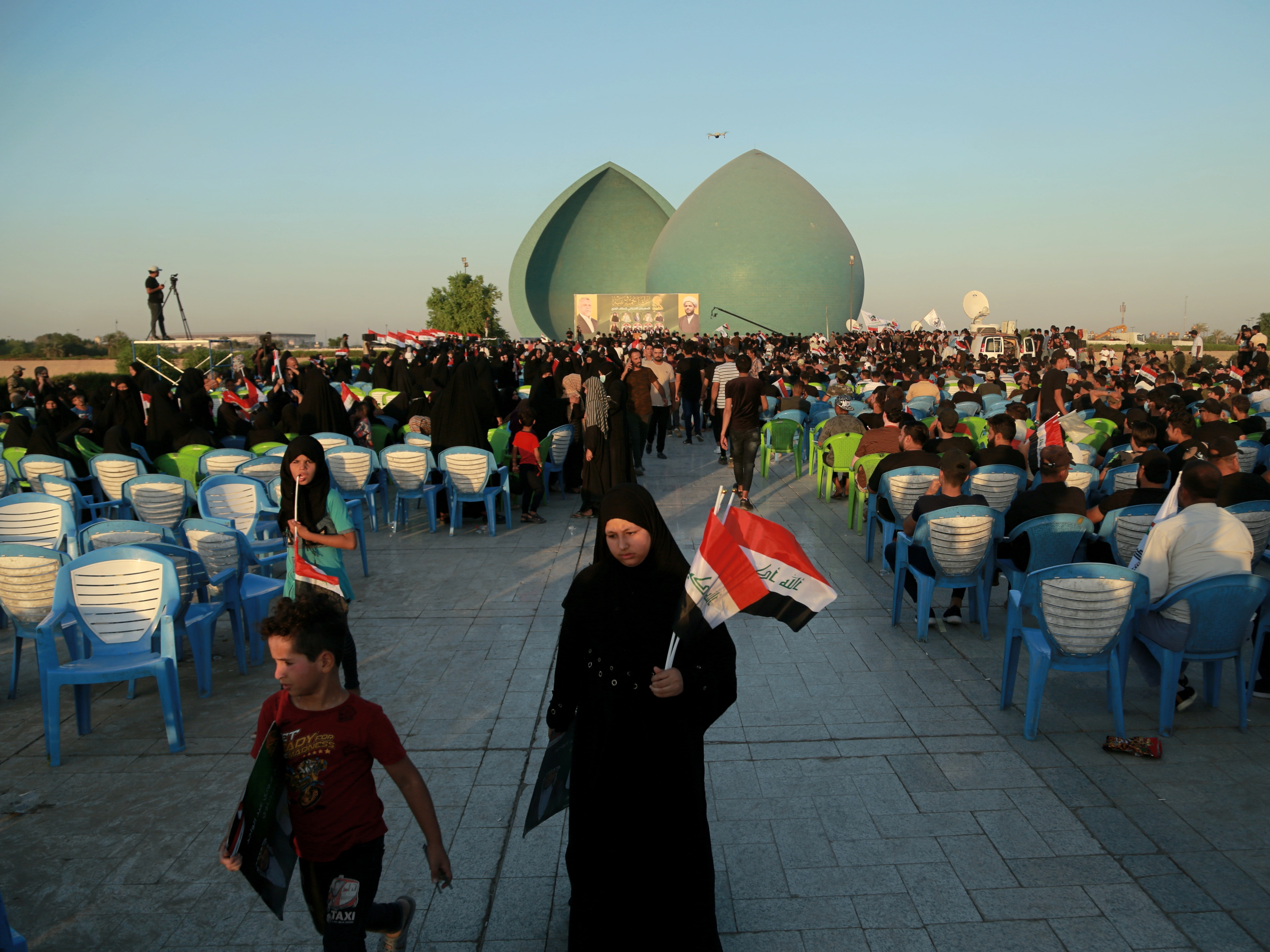 caption: Supporters of Iraq's Al-Fateh Alliance at a rally in Baghdad on Thursday ahead of Sunday's parliamentary elections.