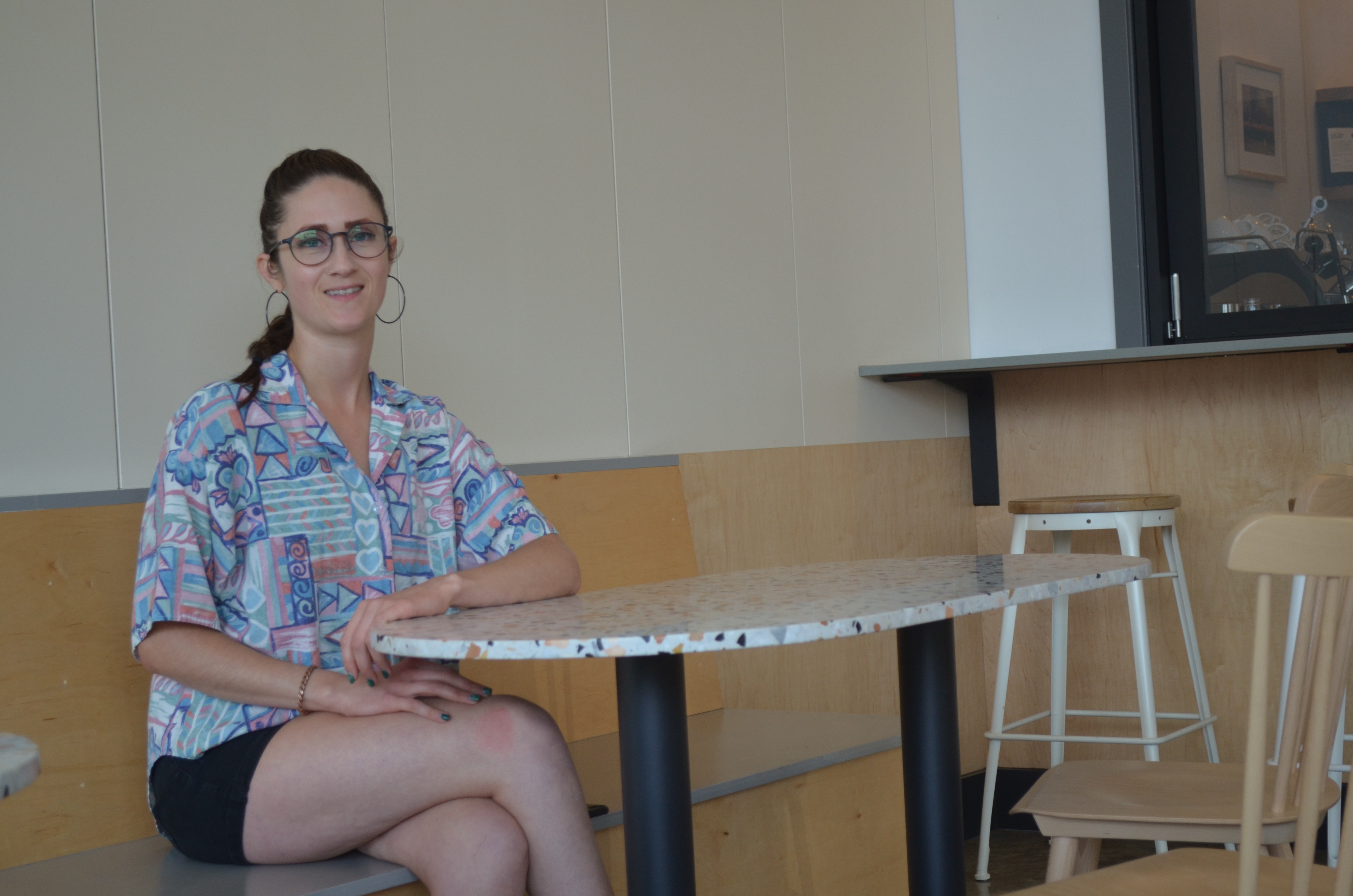 caption: Missy Costell is the manager of Olympia Coffee in Columbia City. She says she's not quite ready to fully reopen the coffee shop.