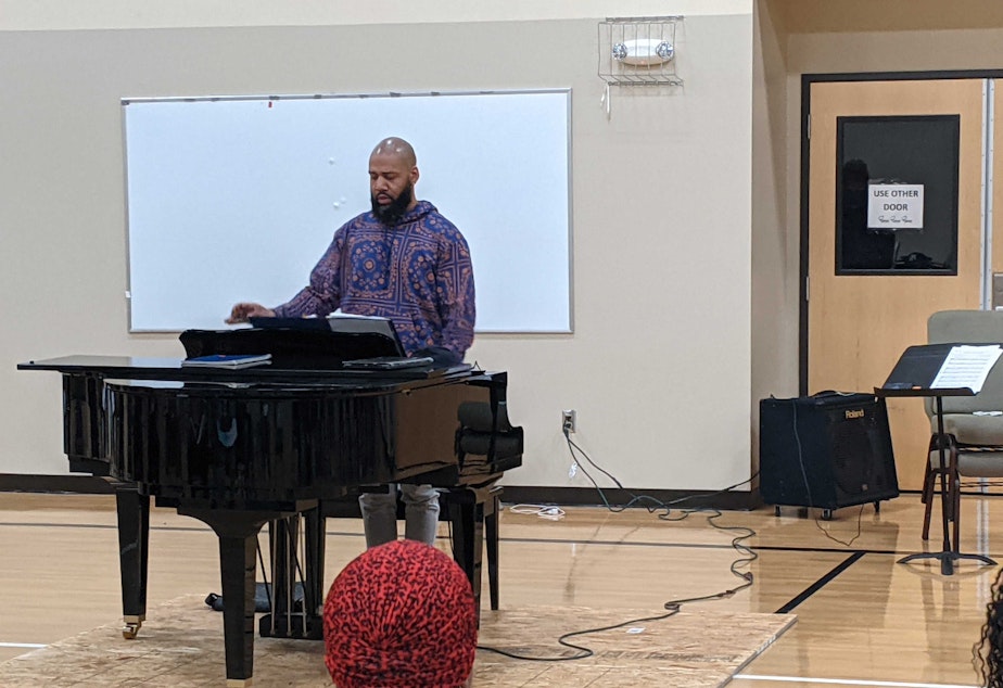 caption: Ramon Bryant Braxton directs a rehearsal with the choir of the One Seattle Juneteenth Celebration on Thursday, June 16, 2022