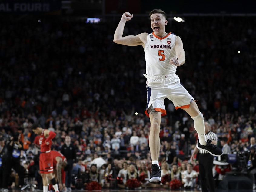 caption: Virginia's Kyle Guy celebrates after helping his team defeat Texas Tech in the NCAA championship tournament. The title game finished in overtime – a first since the University of Kansas beat the University of Memphis in 2008.