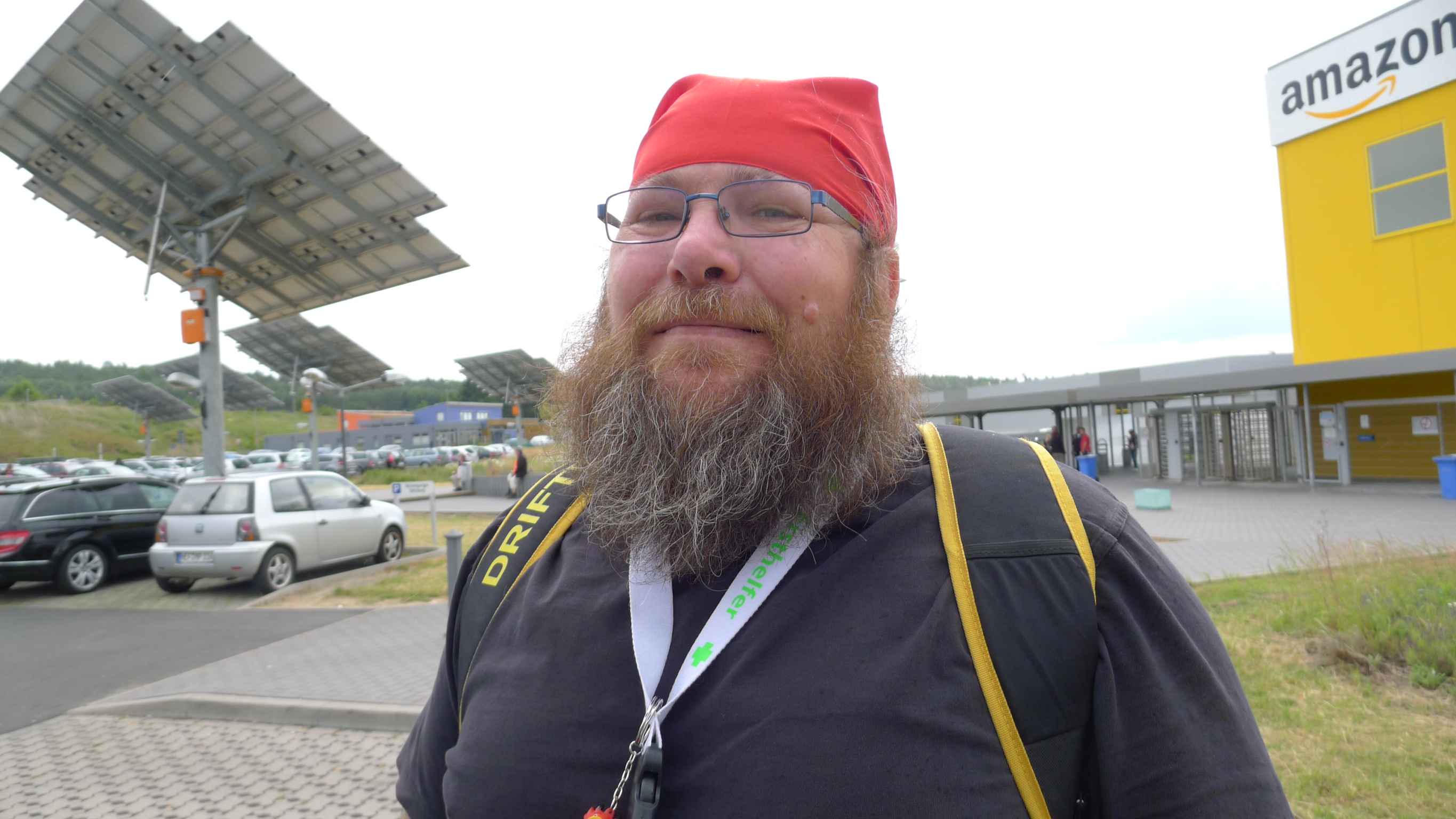 caption: Karl, a worker at a fulfillment center in Germany, said he'll grow his beard until union workers get a contract from Amazon. 