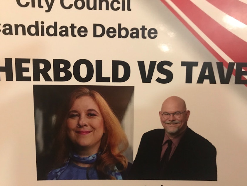 caption: Incumbent Lisa Herbold and challenger Phil Tavel faced off in a debate in their District 1 Seattle City Council race.