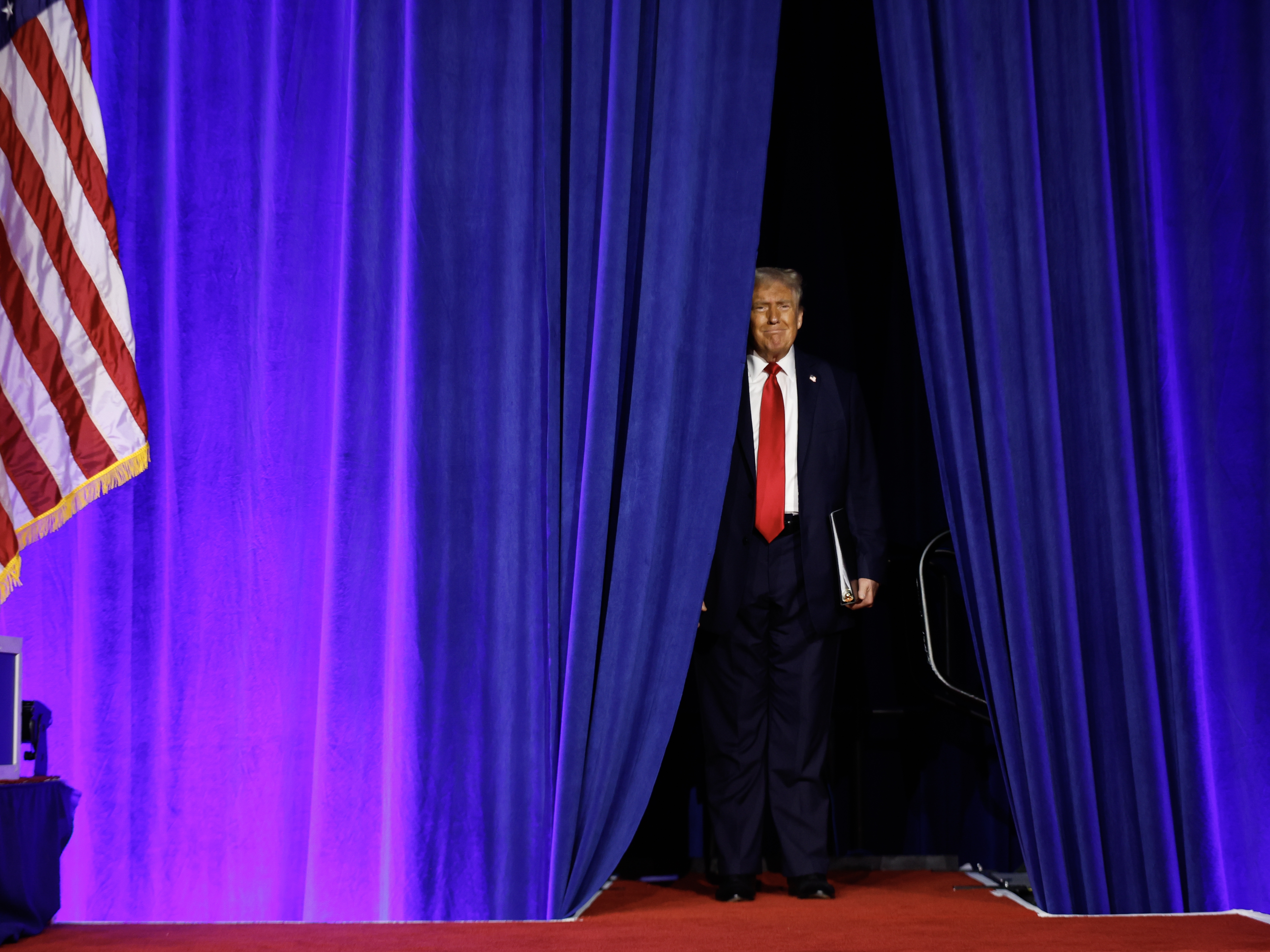 caption: President-elect Donald Trump arrives to speak during an election night event on Nov. 6 at the Palm Beach Convention Center in West Palm Beach, Florida. Trump has articulated ambitious plans for his first 100 days in office.