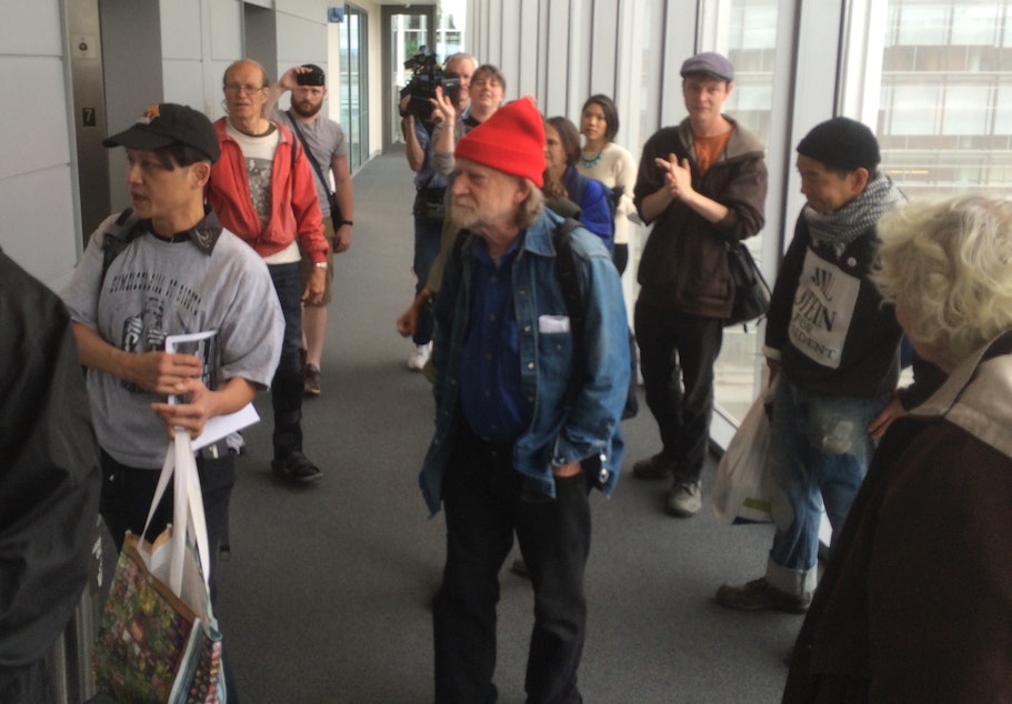 caption: Homeless advocates gather outside Seattle Mayor Ed Murray's office.